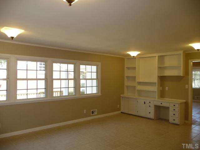 122 Lord Ashley Road Raleigh, NC 27610 - Photo 5 of 25 A wall of windows in the Family Room offers a peaceful wooded view overlooking a new deck and the spacious, fenced back yard. Windows throughout the house were replaced in an earlier renovation.