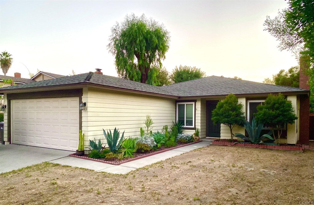 2313 Fallingleaf Road Oceanside, CA 92056 - Photo 1 of 1 a view of a house with a yard and potted plants