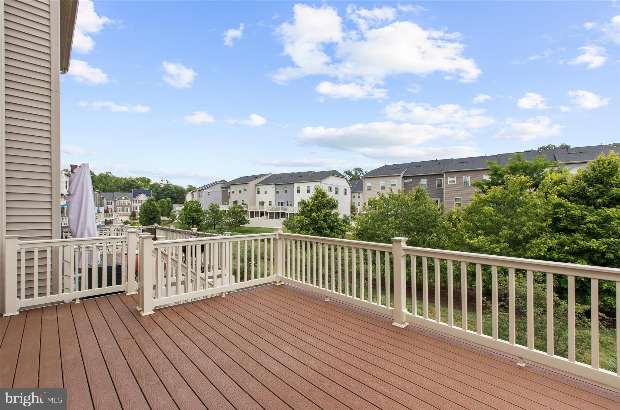 8306 Kippis Road Millersville, MD 21108 - Photo 4 of 62 Trex deck with stairs to fenced yard!