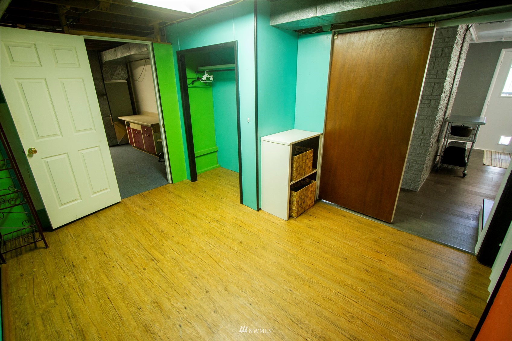 685 Bond Road Castle Rock, WA 98611 - Photo 25 of 37 a view of an empty room with wooden floor
