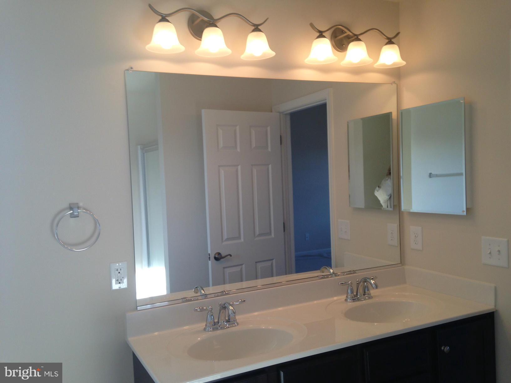 5279 Longbow Road King George, VA 22485 - Photo 22 of 30 a bathroom with a sink and a mirror