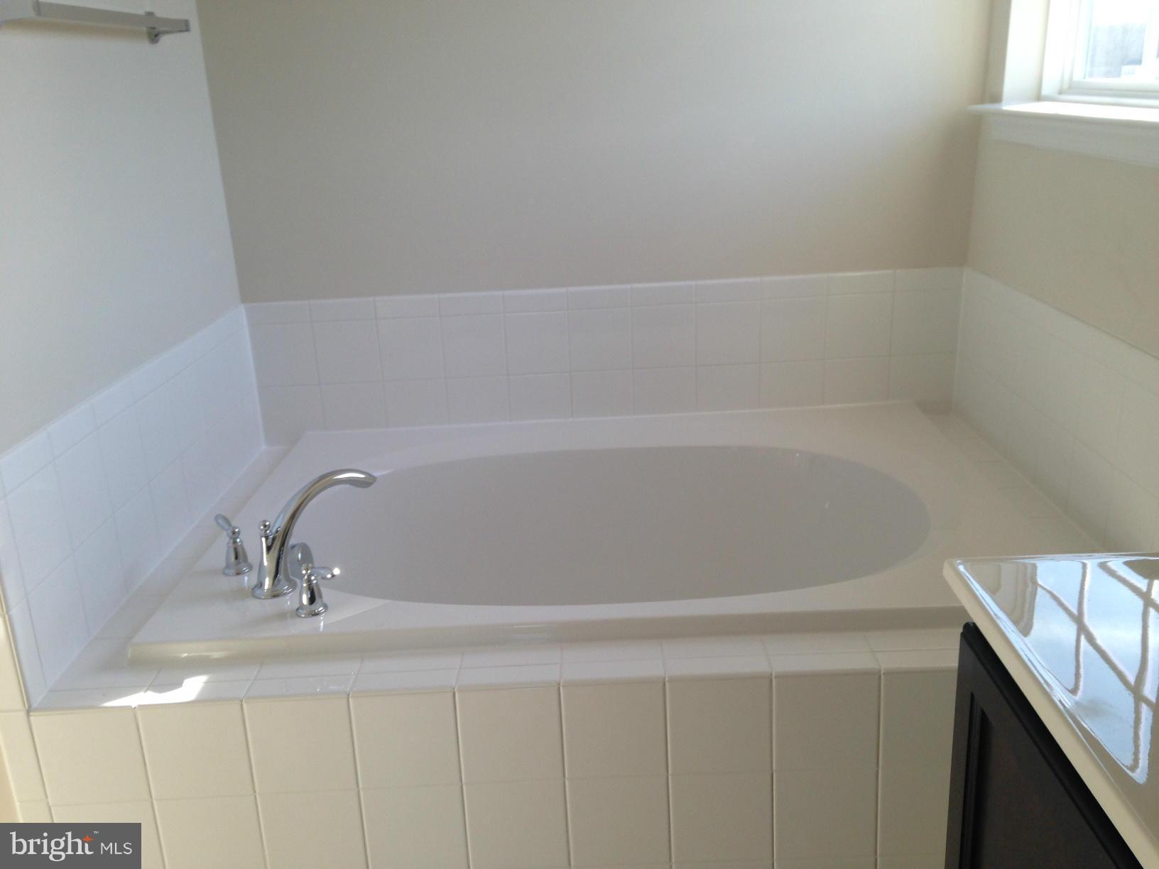 5279 Longbow Road King George, VA 22485 - Photo 23 of 30 a bathroom with a bathtub