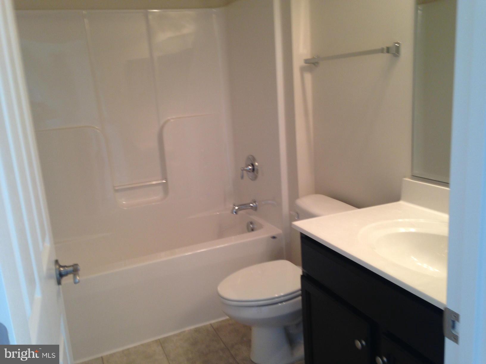 5279 Longbow Road King George, VA 22485 - Photo 24 of 30 a bathroom with a sink a toilet and shower