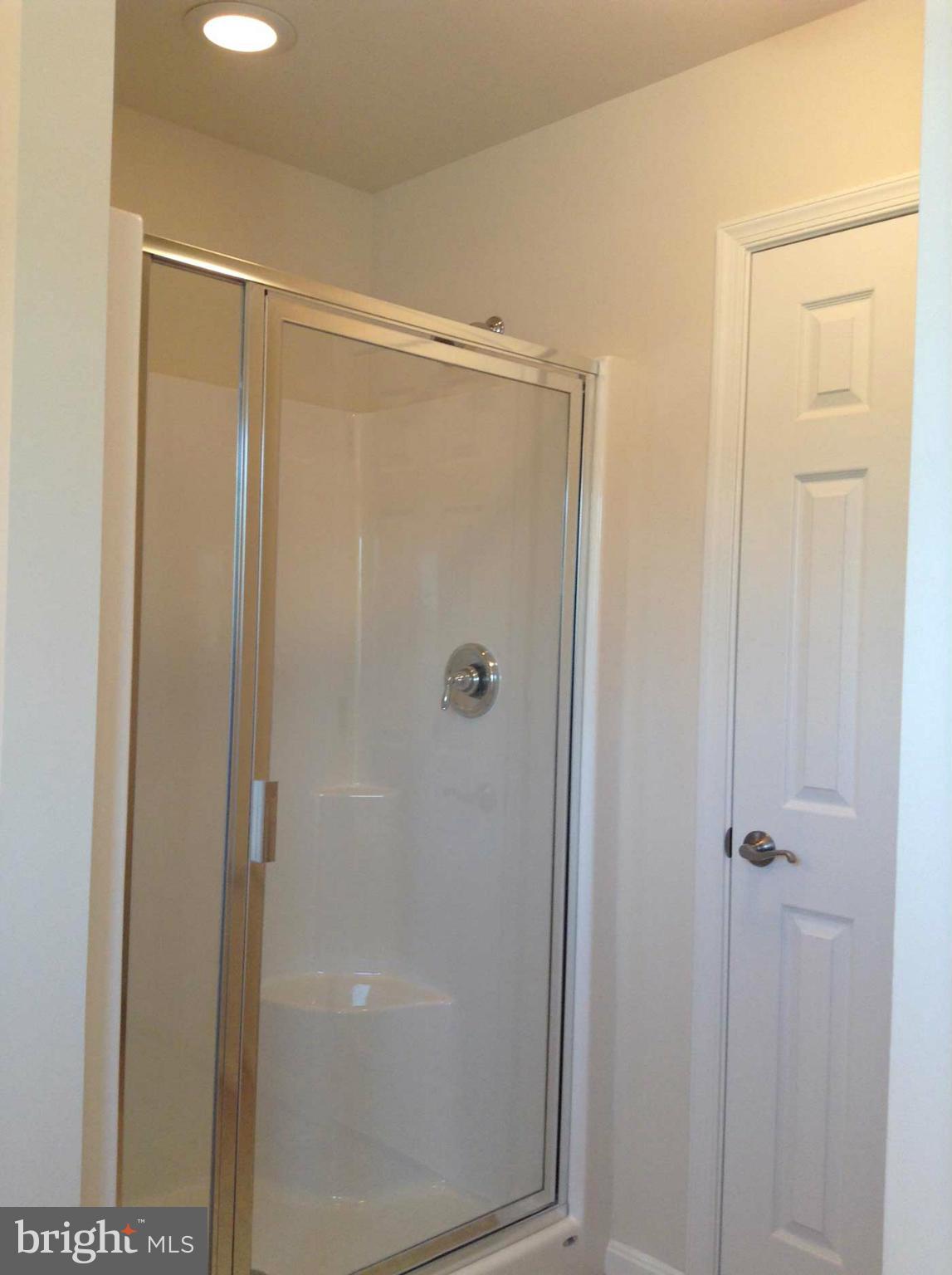5279 Longbow Road King George, VA 22485 - Photo 29 of 30 a bathroom with a glass shower door