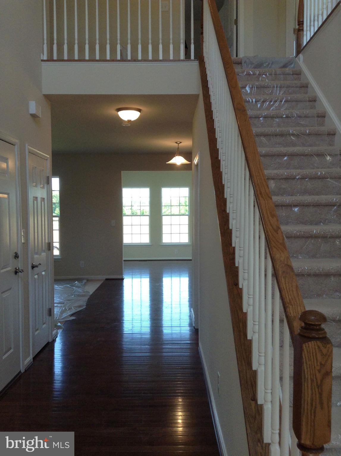 5279 Longbow Road King George, VA 22485 - Photo 9 of 30 a view of entryway and hall with wooden floor