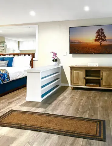 a living room with furniture and a flat screen tv