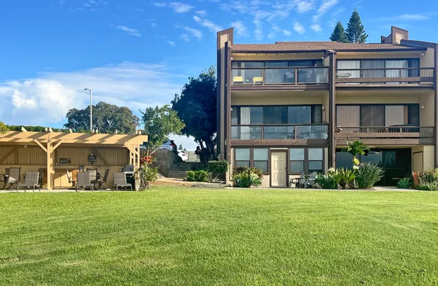 a front view of building with yard