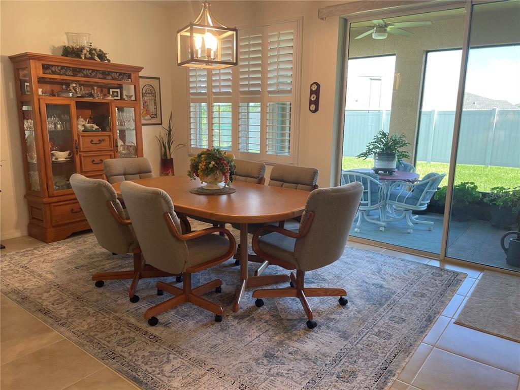 6209 Southwest 89th St Road Ocala, FL 34476 - Photo 11 of 27 a dining room with furniture and window