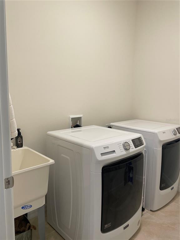 6209 Southwest 89th St Road Ocala, FL 34476 - Photo 16 of 27 a utility room with dryer and washer