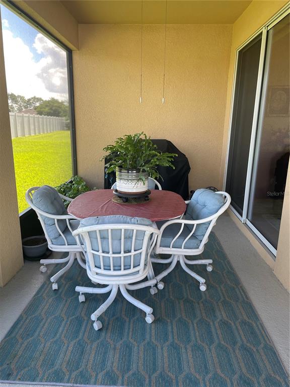 6209 Southwest 89th St Road Ocala, FL 34476 - Photo 26 of 27 a view of a dining room with furniture window and wooden floor