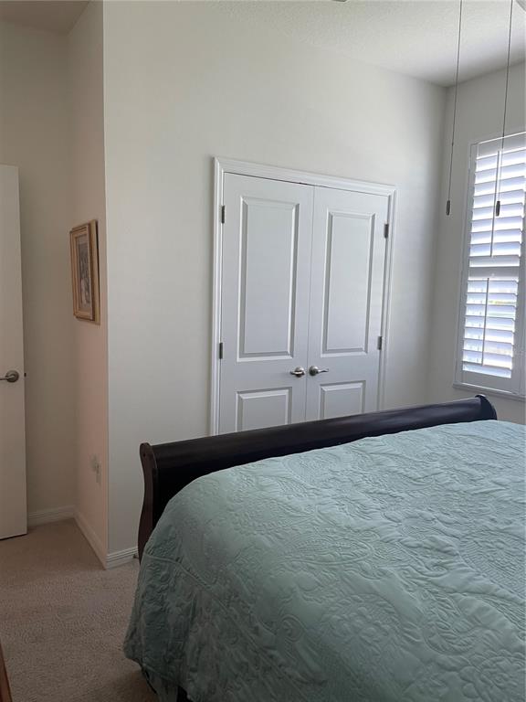 6209 Southwest 89th St Road Ocala, FL 34476 - Photo 4 of 27 a bedroom with a bed and a window