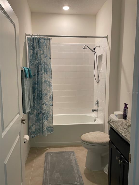 6209 Southwest 89th St Road Ocala, FL 34476 - Photo 5 of 27 a bathroom with a granite countertop bathtub shower sink vanity and toilet