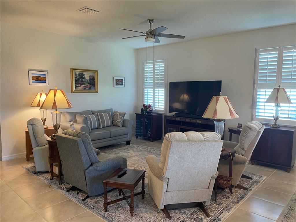 6209 Southwest 89th St Road Ocala, FL 34476 - Photo 9 of 27 a living room with furniture and a window