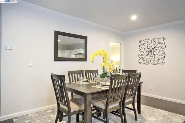 a kitchen with stainless steel appliances kitchen island granite countertop a refrigerator and a sink