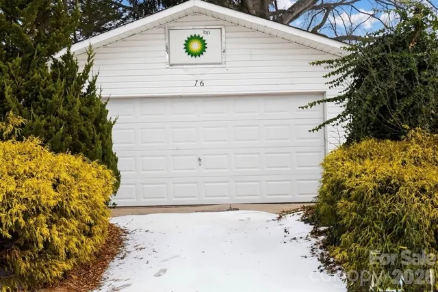 a view of backyard with plants and outdoor seating