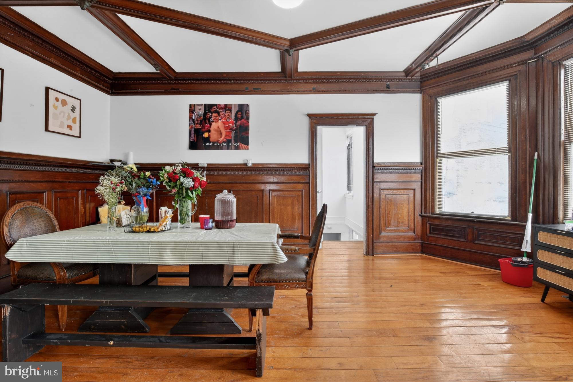 a view of a dining room with furniture window and wooden floor
