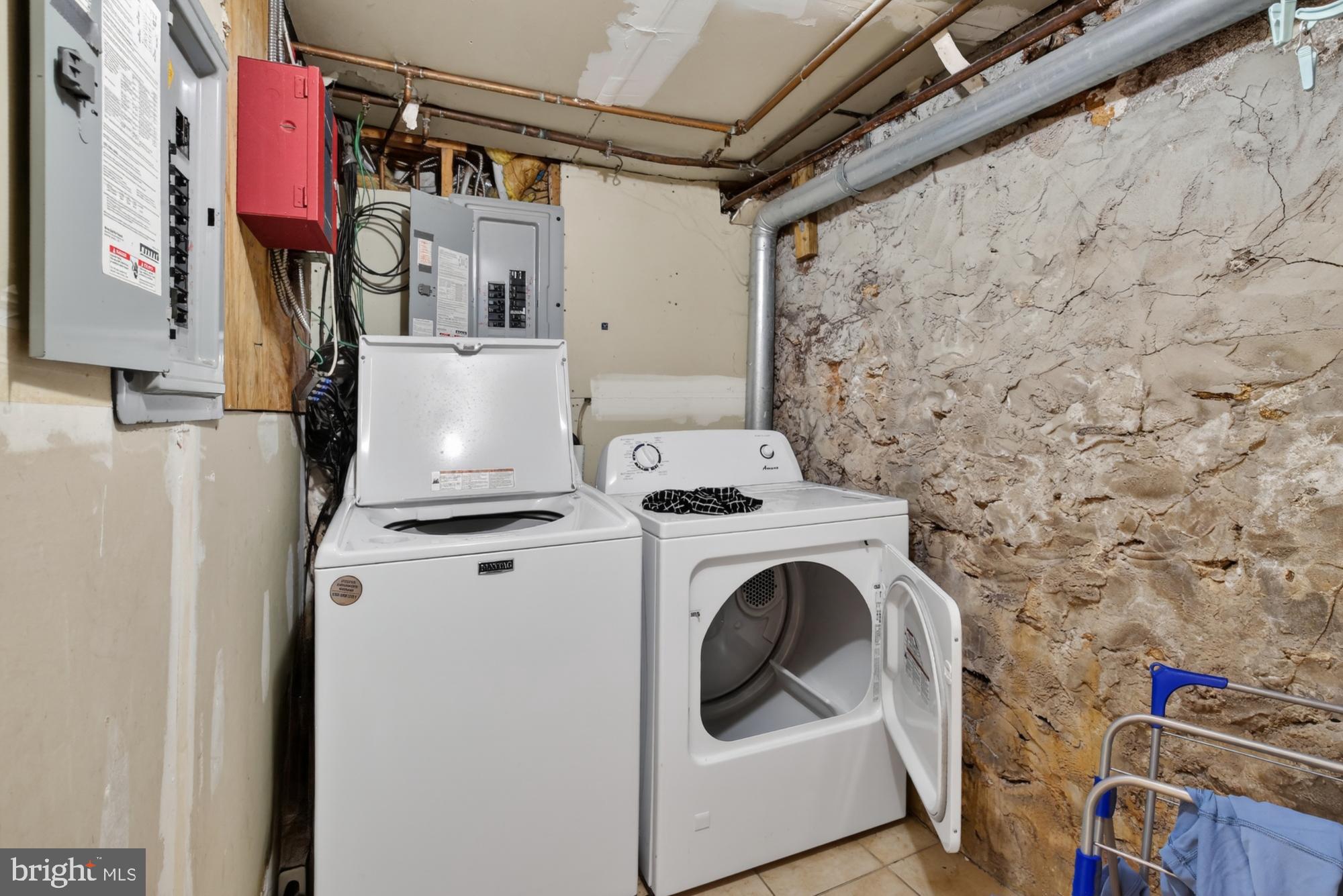 4001 Baltimore Avenue Philadelphia, PA 19104 - Photo 14 of 40 a view of storage and utility room with washer and dryer