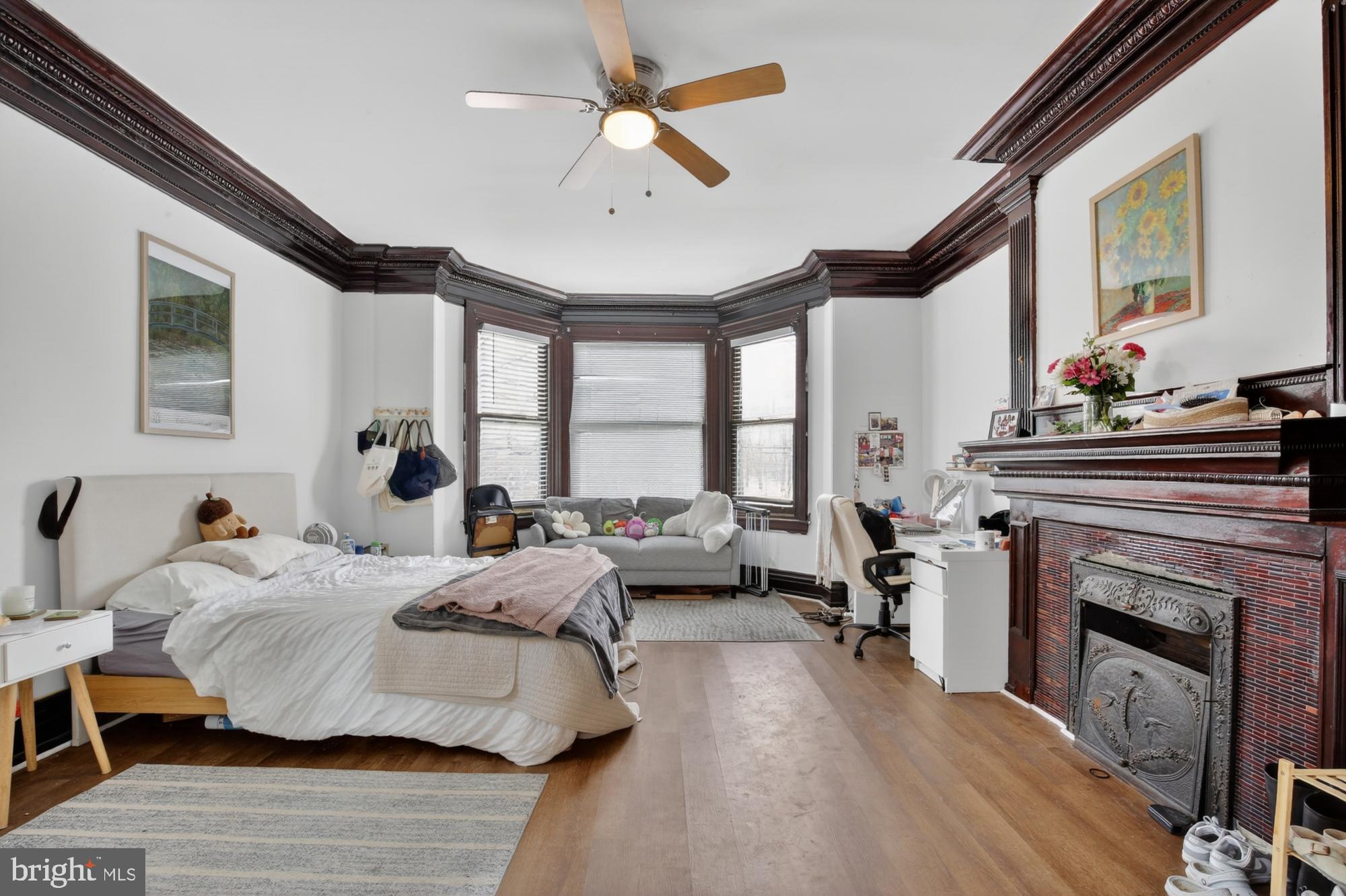 4001 Baltimore Avenue Philadelphia, PA 19104 - Photo 15 of 40 a bedroom with furniture and a fireplace