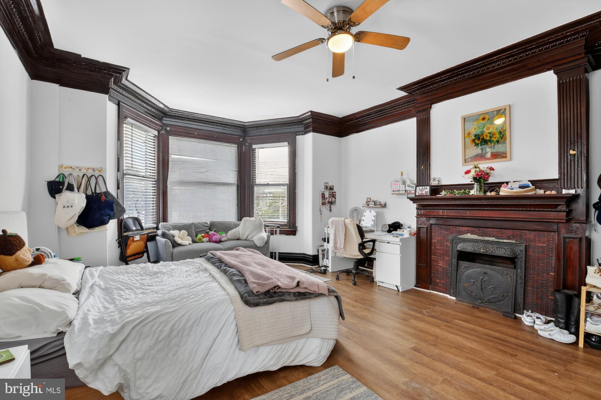 4001 Baltimore Avenue Philadelphia, PA 19104 - Photo 16 of 40 a bed room with a bed and a fireplace