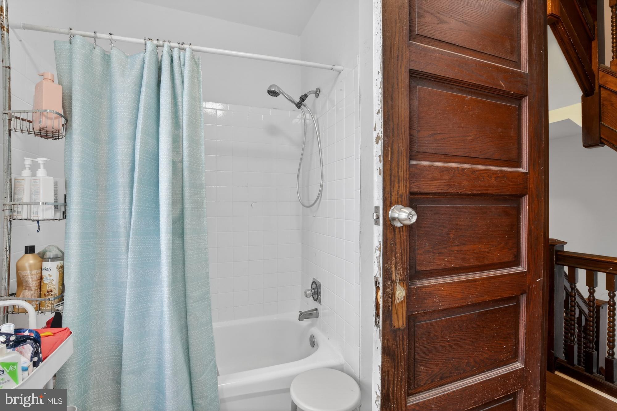 4001 Baltimore Avenue Philadelphia, PA 19104 - Photo 19 of 40 a bathroom with a shower and a tub