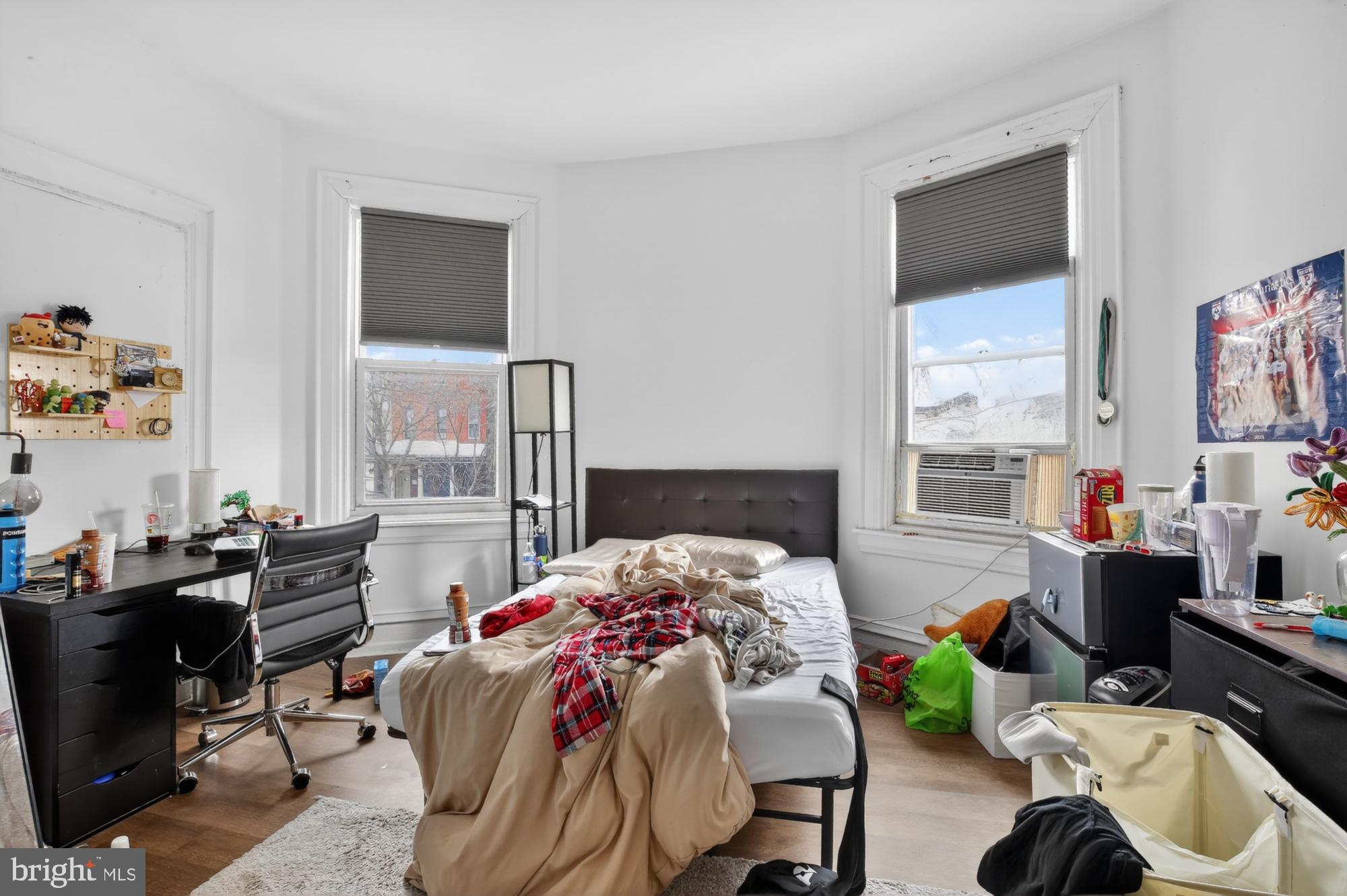 4001 Baltimore Avenue Philadelphia, PA 19104 - Photo 20 of 40 a bedroom with a bed and large windows