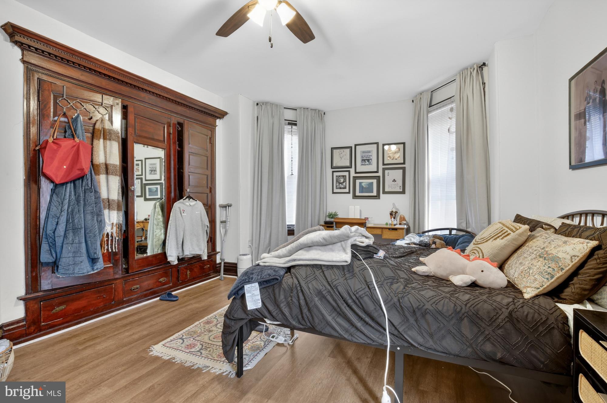 4001 Baltimore Avenue Philadelphia, PA 19104 - Photo 22 of 40 a living room with furniture a bed and a chandelier