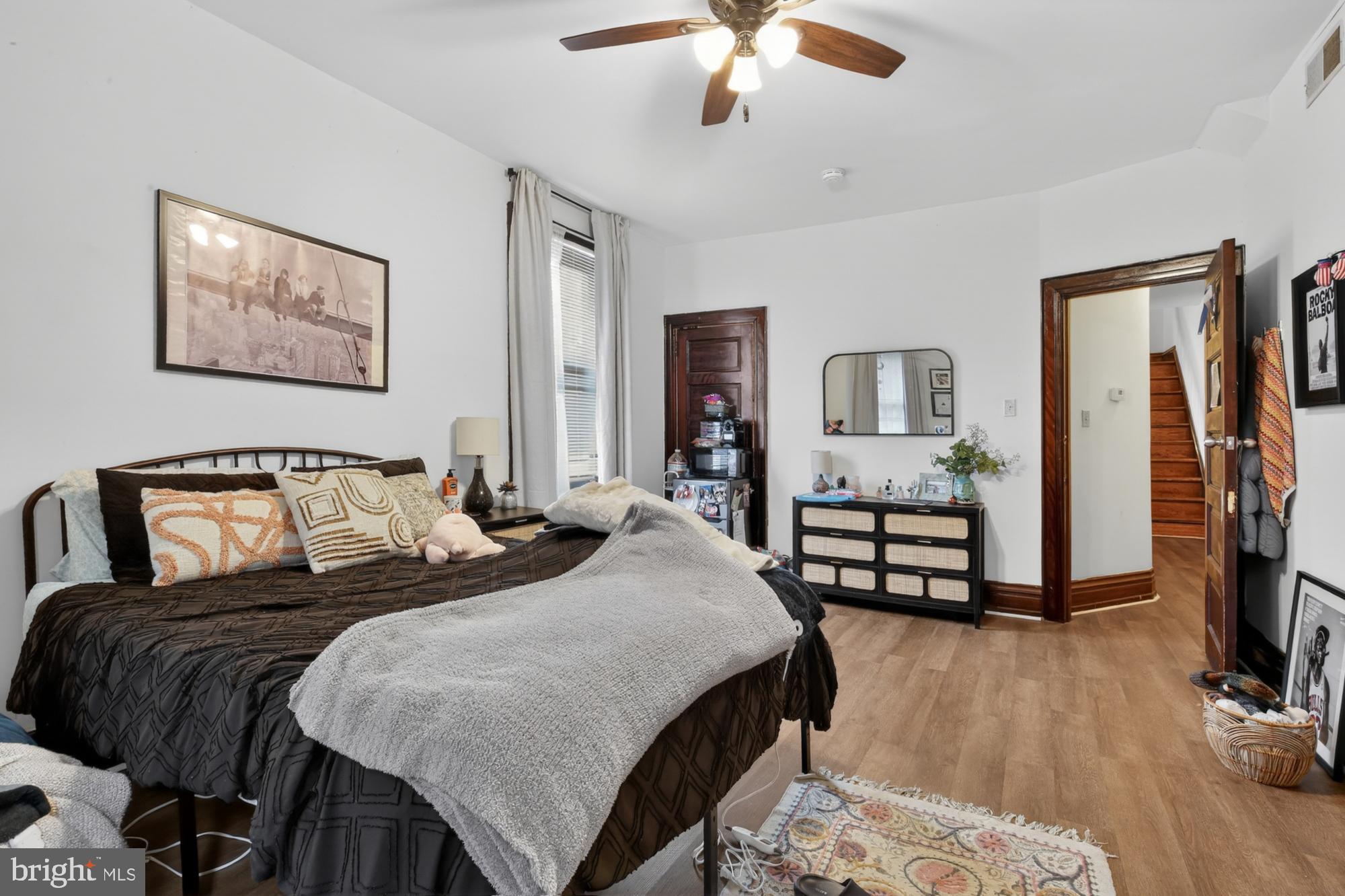 4001 Baltimore Avenue Philadelphia, PA 19104 - Photo 23 of 40 a bedroom with bed and a chandelier