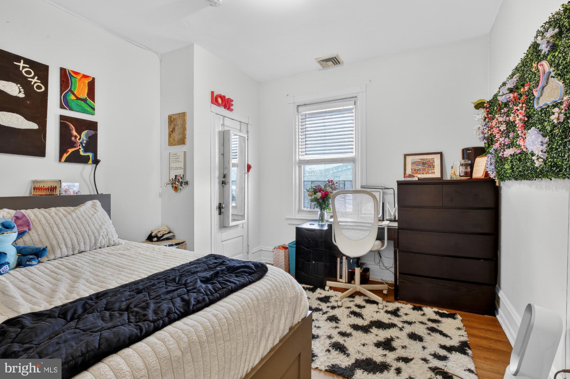 4001 Baltimore Avenue Philadelphia, PA 19104 - Photo 31 of 40 a bedroom with a bed and a chandelier
