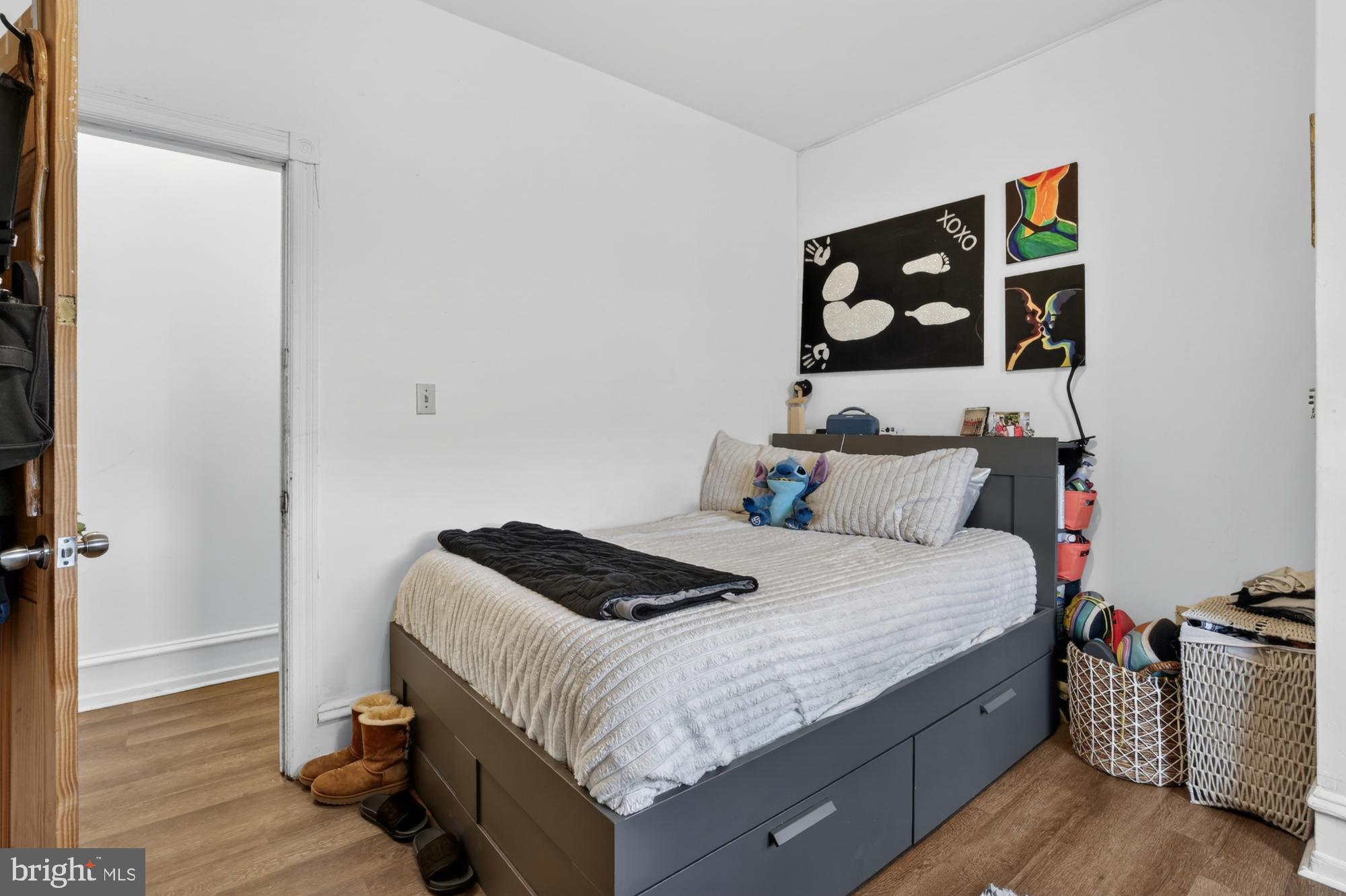 4001 Baltimore Avenue Philadelphia, PA 19104 - Photo 32 of 40 a bedroom with a bed and wooden floor