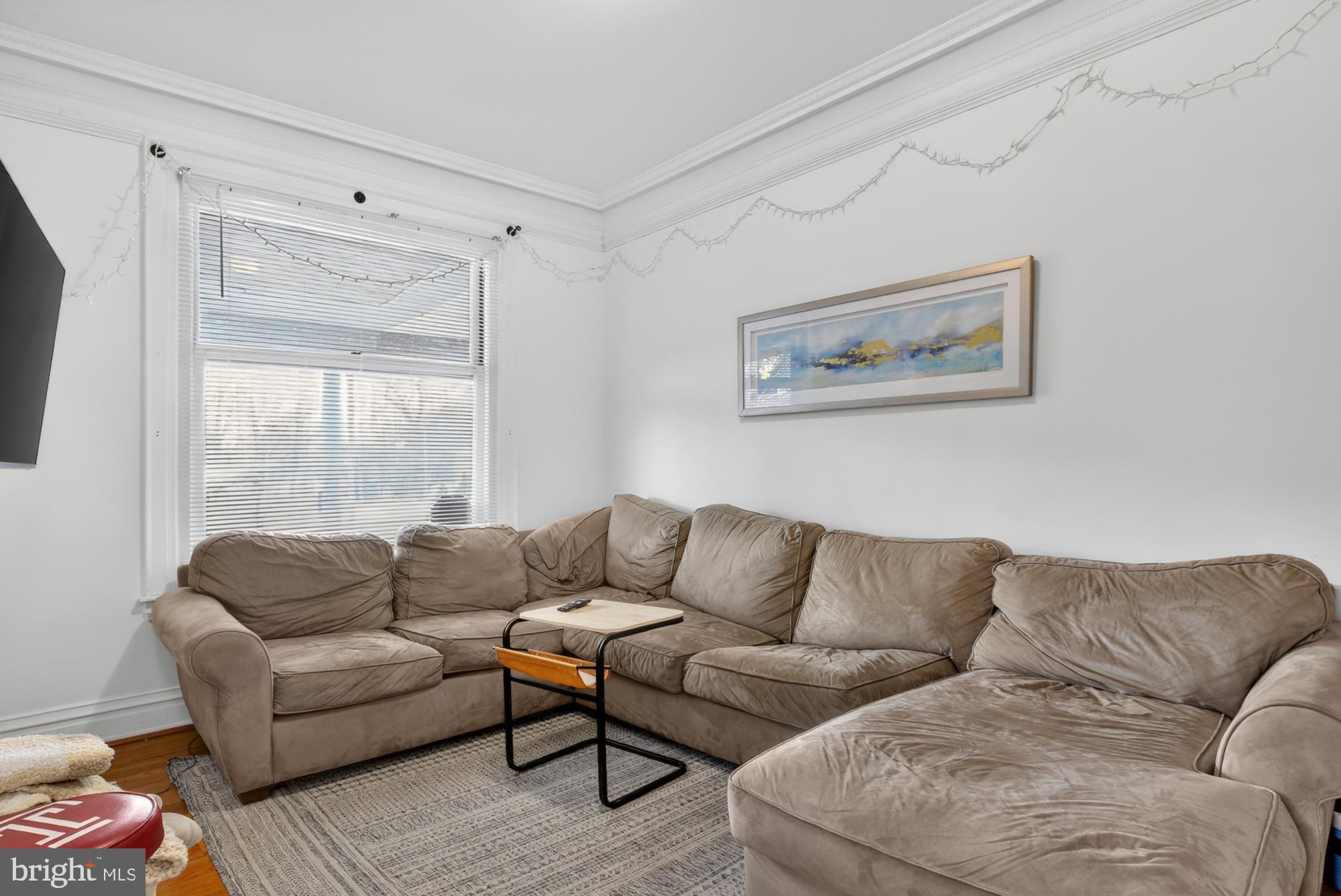 4001 Baltimore Avenue Philadelphia, PA 19104 - Photo 4 of 40 a living room with furniture a couch and a flat screen tv