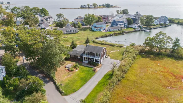 an aerial view of a house with a swimming pool