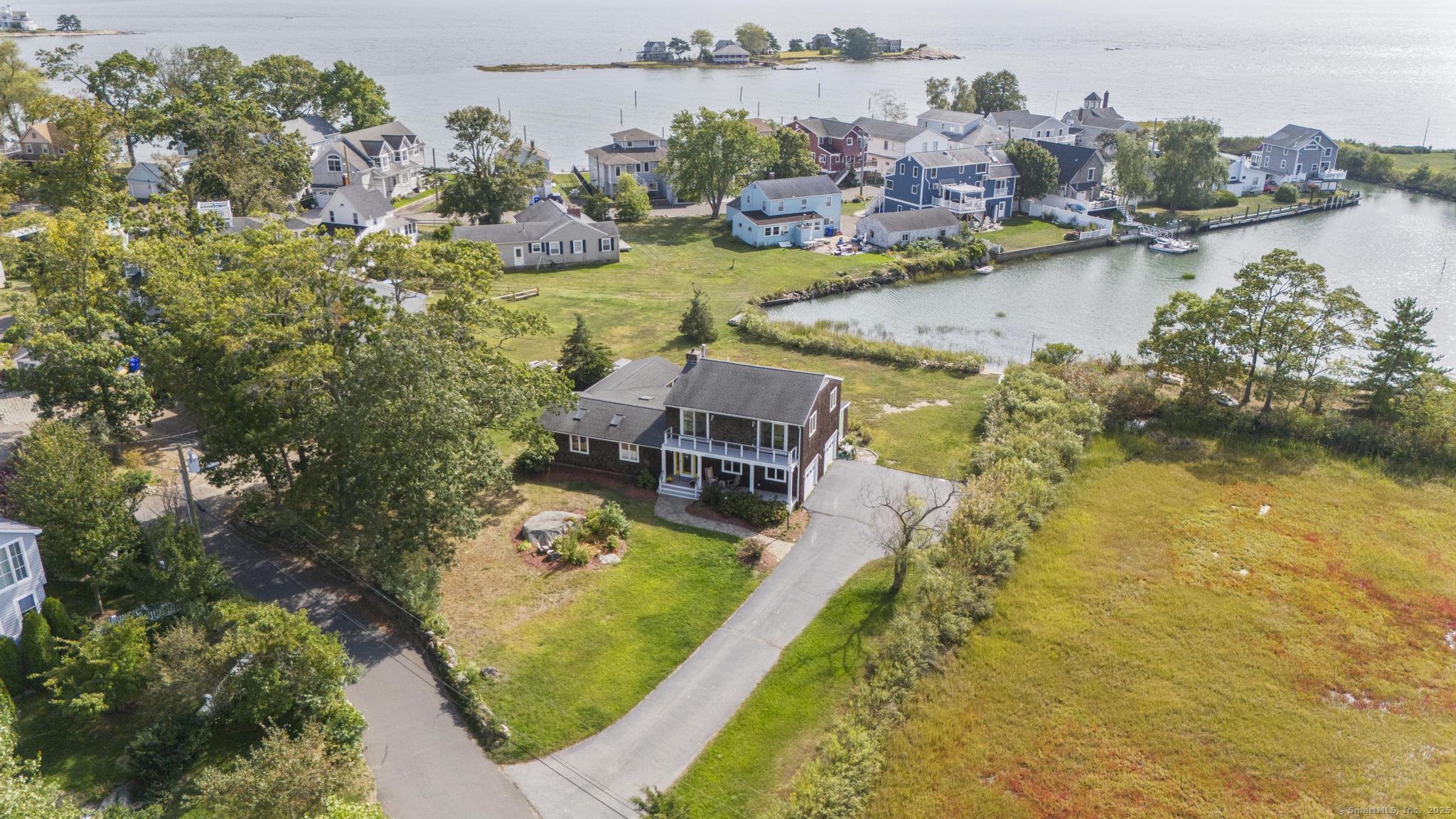 an aerial view of a house with a swimming pool