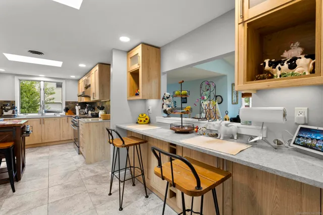 a kitchen with sink cabinets and dining table