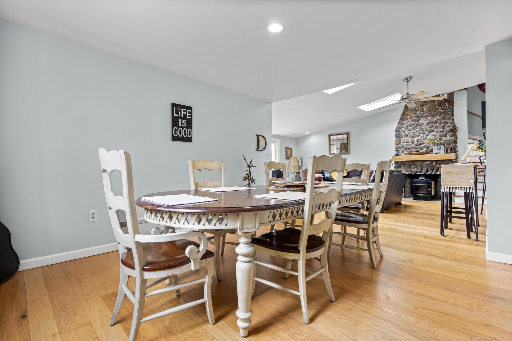 94 Summer Island Road Branford, CT 06405 - Photo 15 of 40 a view of a dining room with furniture and wooden floor