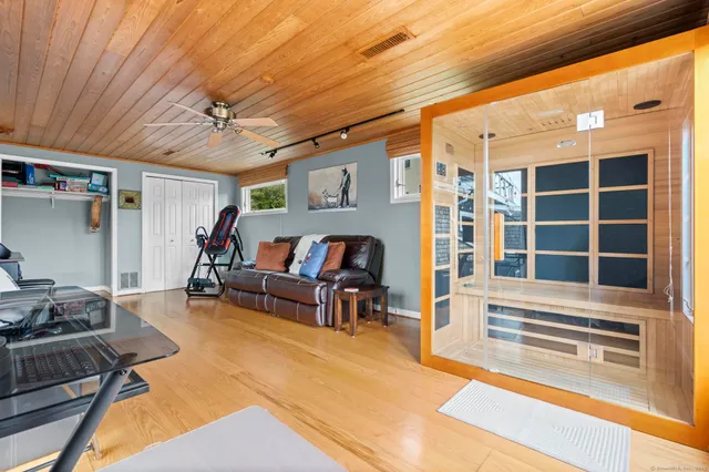 a bed room with a bed and a chair