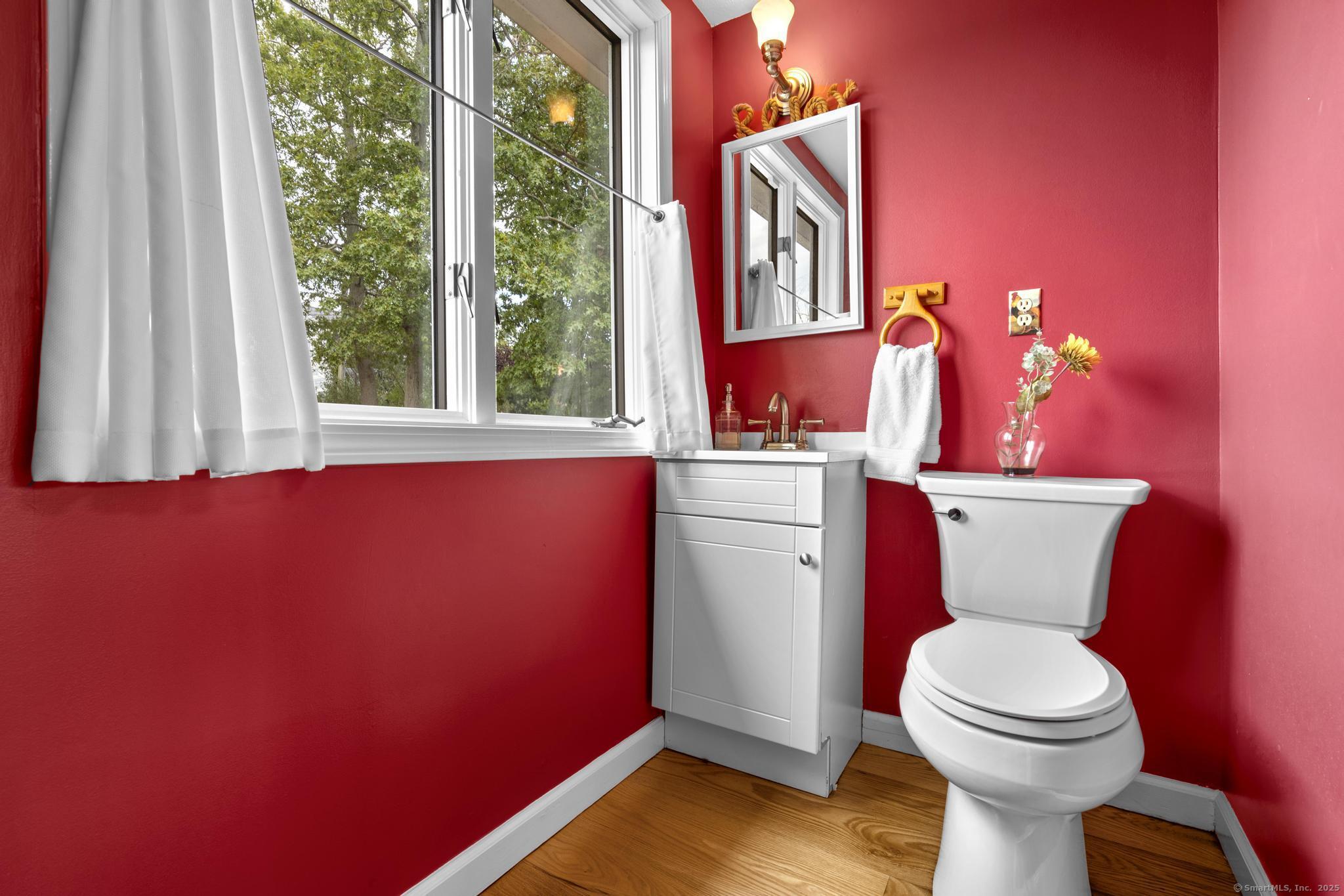 94 Summer Island Road Branford, CT 06405 - Photo 18 of 40 a bathroom with a toilet a sink and a window