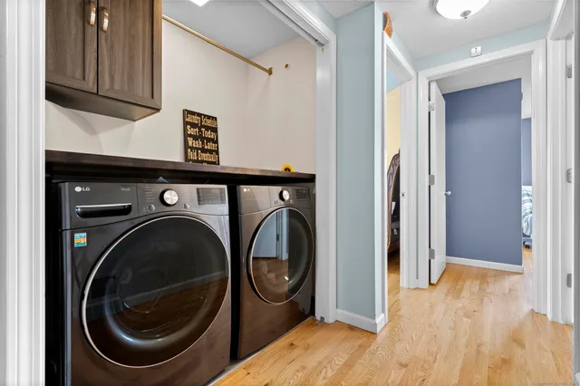 a view of a hallway with washer and dryer