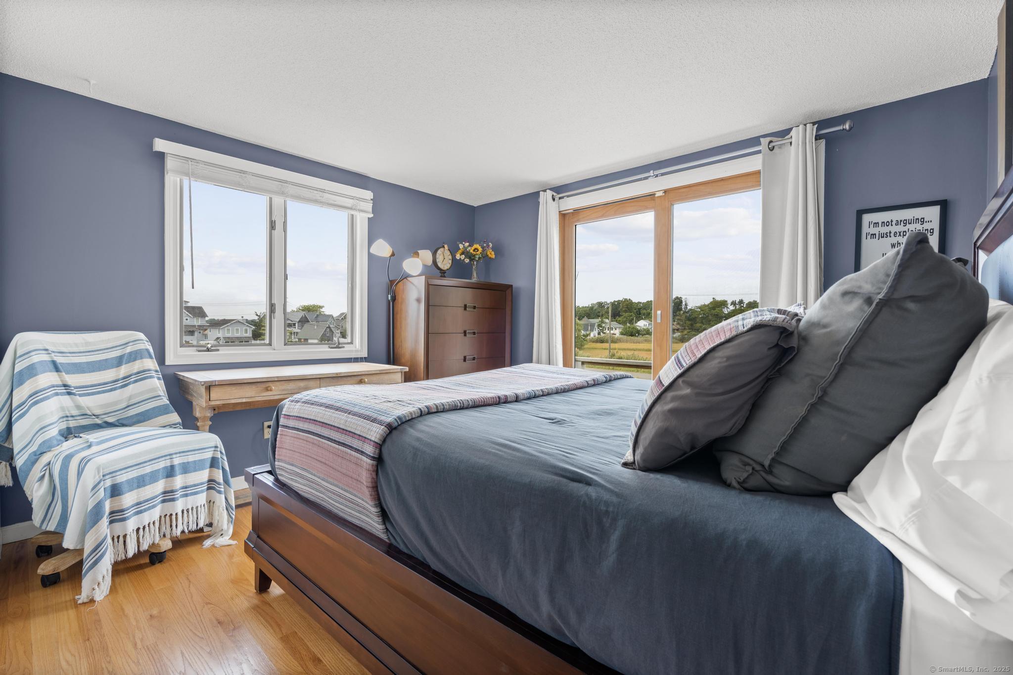 94 Summer Island Road Branford, CT 06405 - Photo 23 of 40 a bedroom with two beds and a large window