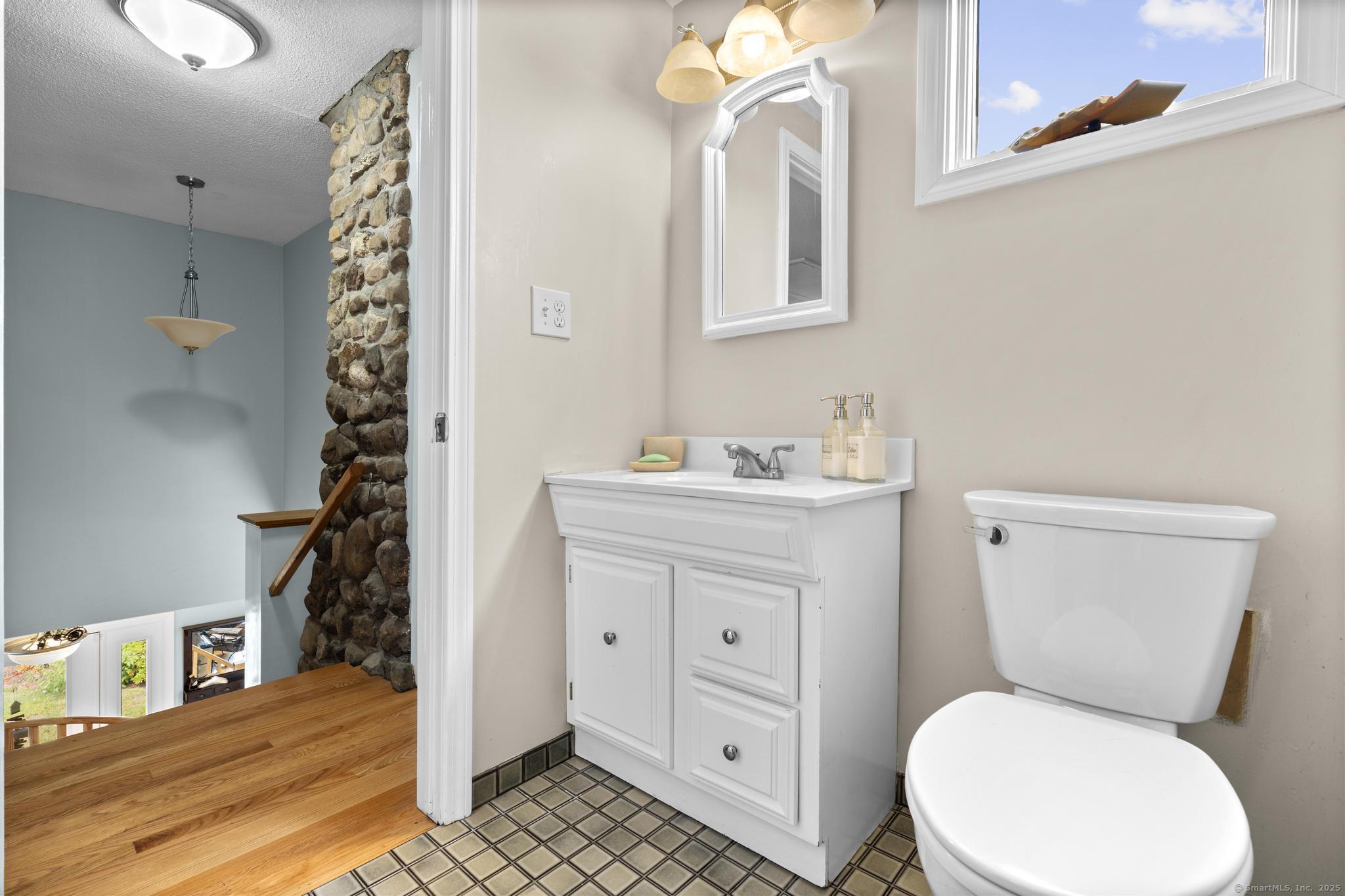 94 Summer Island Road Branford, CT 06405 - Photo 26 of 40 a bathroom with a sink toilet vanity and tub