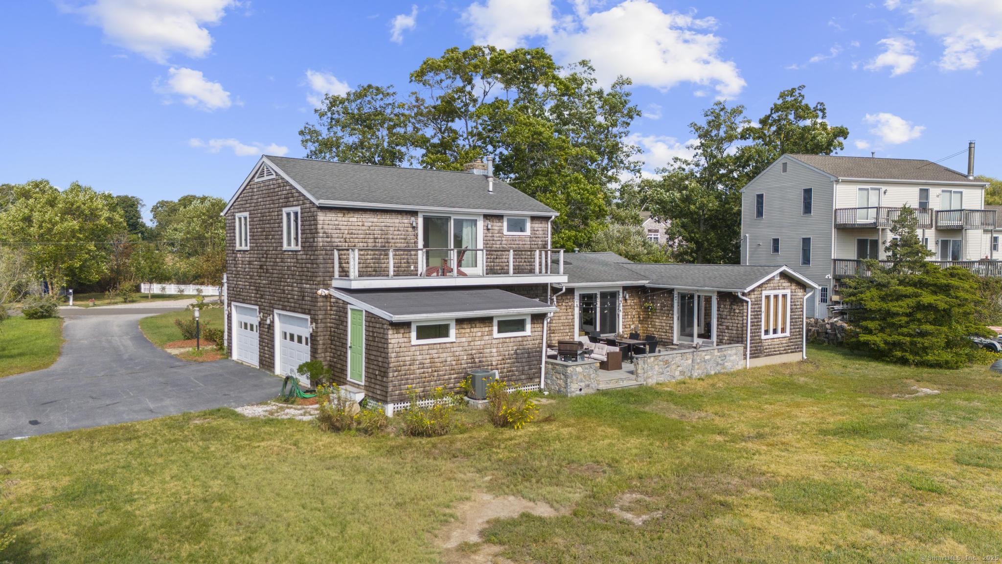 94 Summer Island Road Branford, CT 06405 - Photo 34 of 40 front view of a house with a yard
