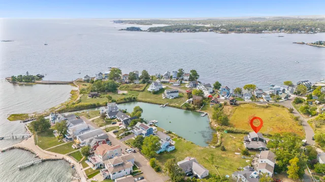 an aerial view of a houses with a lake view