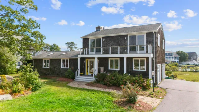 a view of backyard with a garden and plants