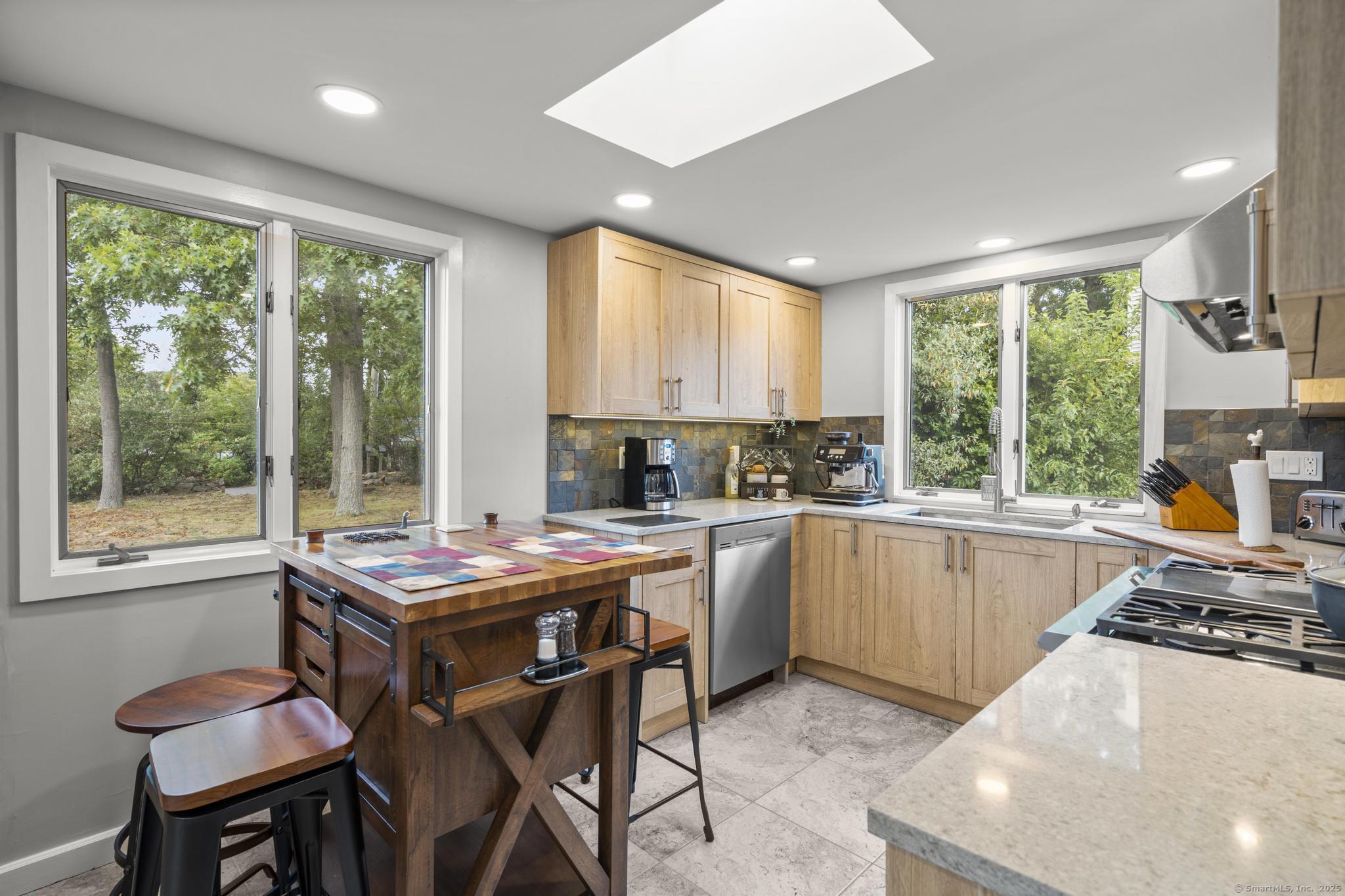 94 Summer Island Road Branford, CT 06405 - Photo 10 of 40 a kitchen with a stove a sink and a refrigerator