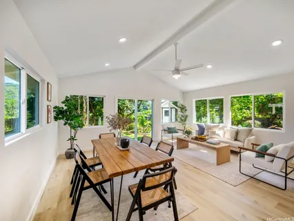 a view of a dining room with furniture window and outside view