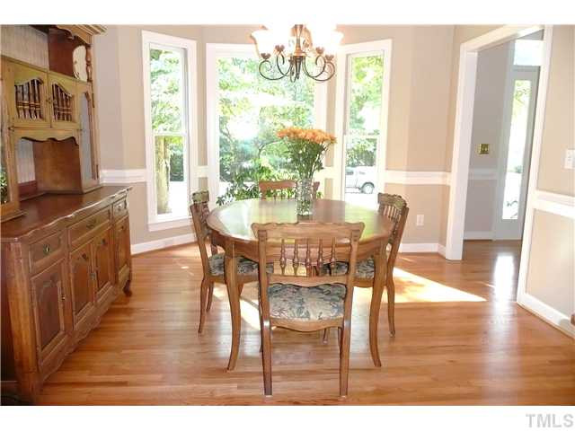 5116 Salem Ridge Road Holly Springs, NC 27540 - Photo 8 of 25 Can you just envision holiday dinners in this beautiful formal dining room? With hardwoods, chair rail and bay window, this spacious room is perfect for formal entertaining. Dining Room