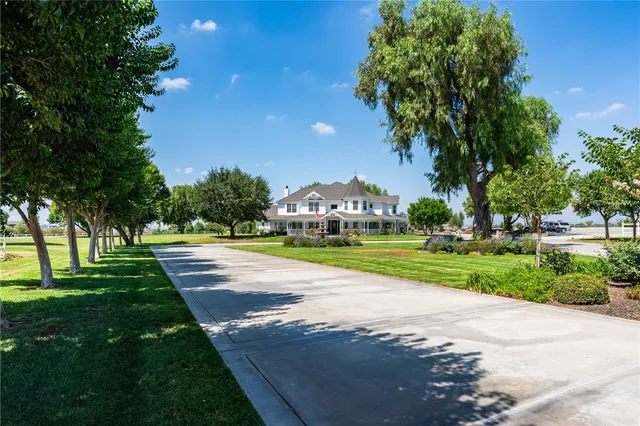 a view of yard with swimming pool and green space