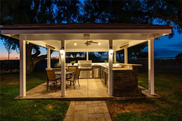 a view of a chairs and tables in patio