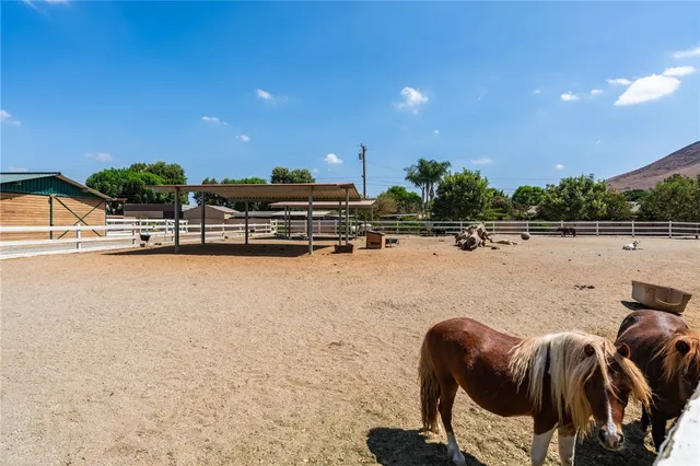 a view of a swimming pool with an outdoor seating and a projector