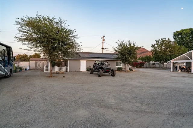 a view of a car park in front of house