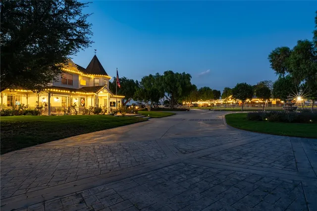 a view of yard with swimming pool and green space